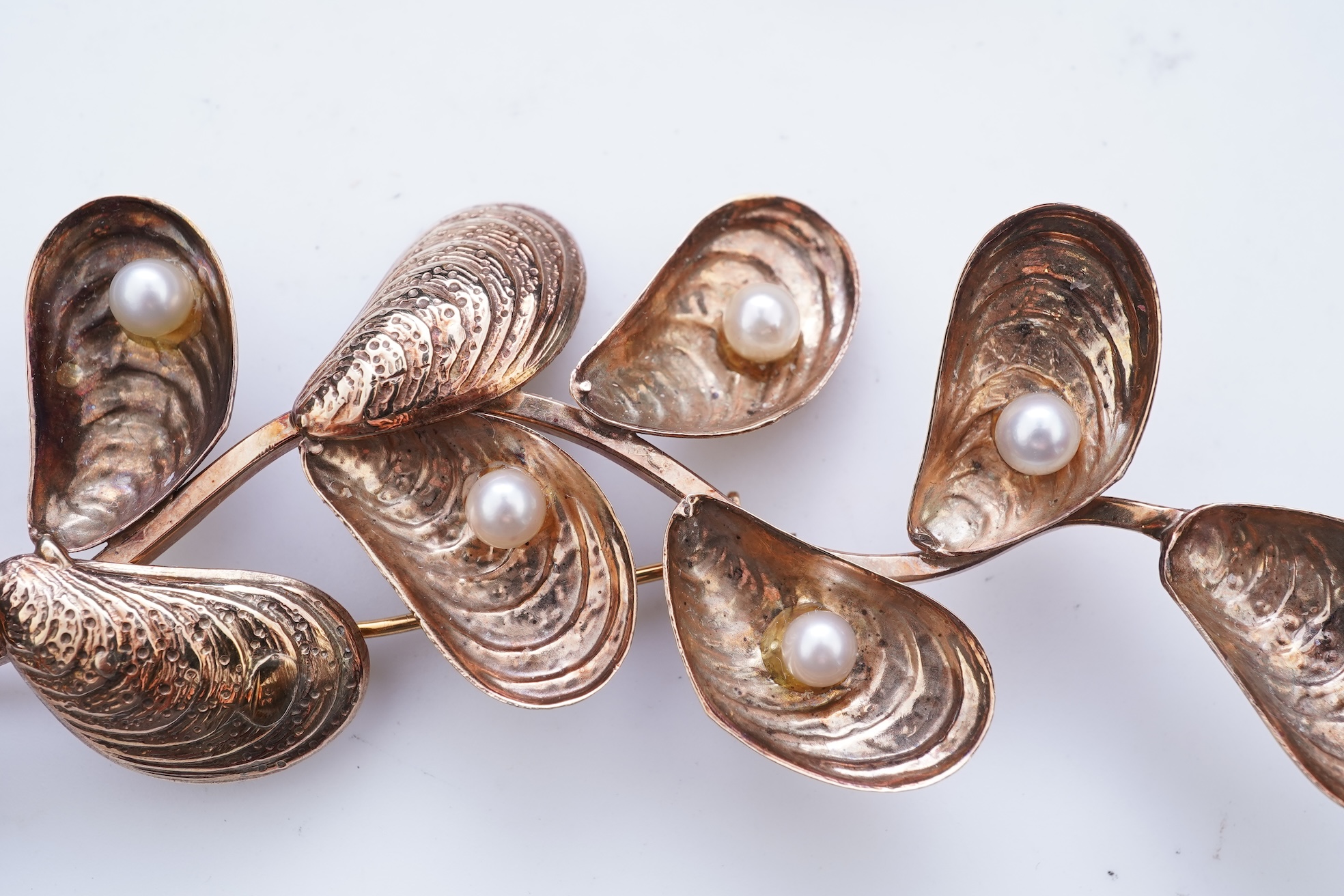 Two cultured pearl brooches